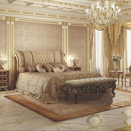 Luxurious bedroom design with a stylish tufted headboard, velvet footboard, exquisite chandelier, and other refined touches.