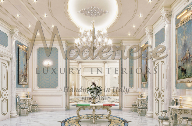 Light blue fabric and white walls Modenese entrance room with chandelier and round table