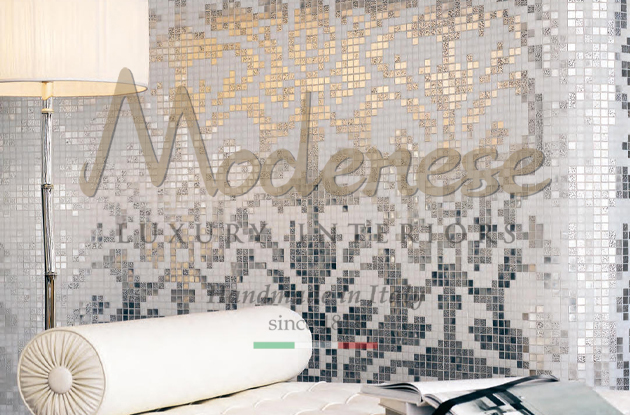 Modenese grey and black mosaic design on walls with lamp and white pillow