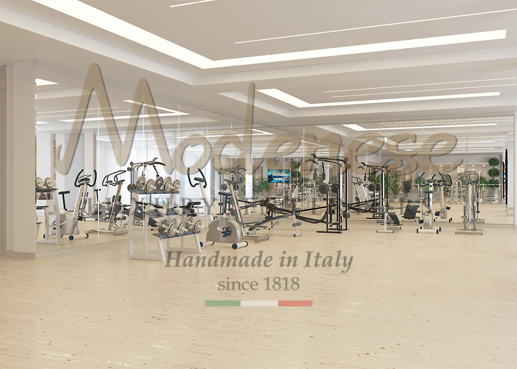 Gym project designed by Modenese Interiors with light cream floors