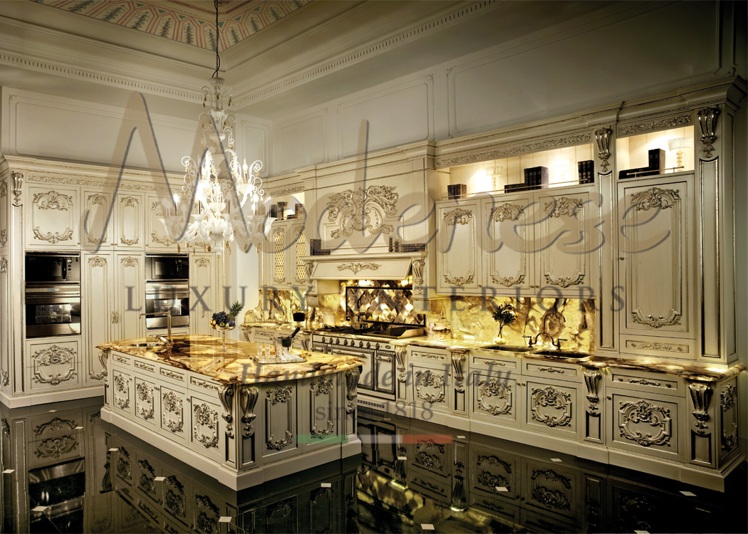 Baroque ivory luxury kitchen with central island gold leaf decorations and marble details by Modenese