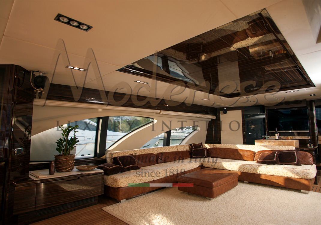 Modenese interior design contemporary yacht with ebony makassar furniture and warm brown sofa