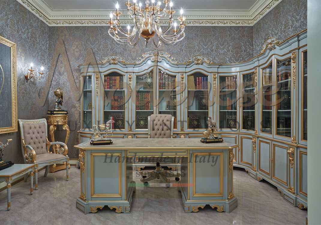 Turquoise and gold leaf desk with leather armchair and classic style bookshelf in a Modenese Interiors private office project