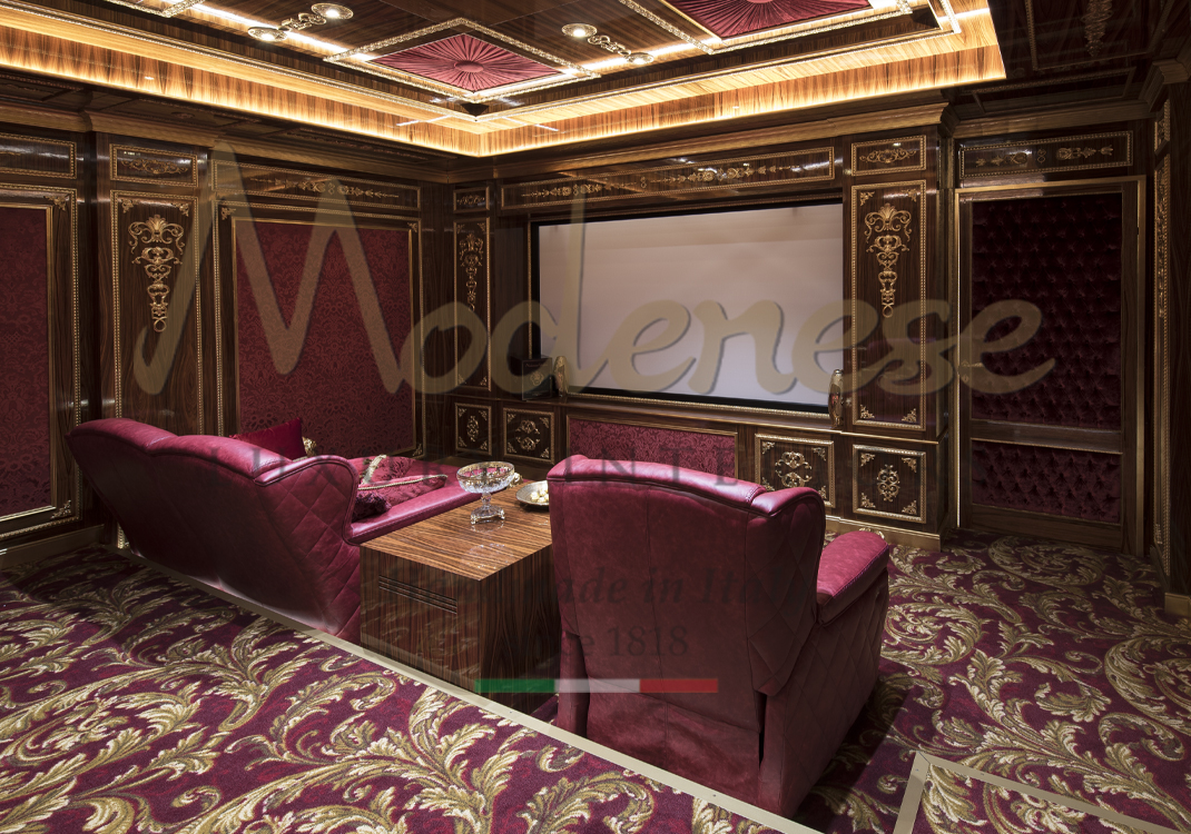 Red fabric armchairs and red upholstered walls and floors Modenese home cinema