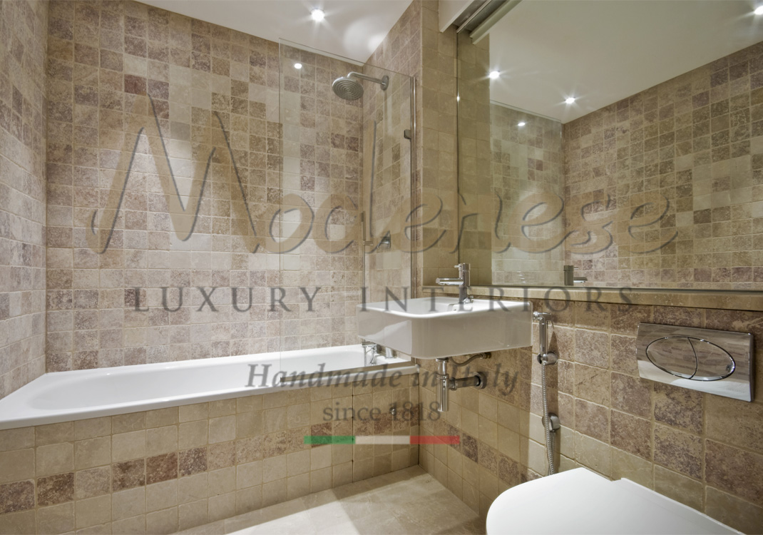 Brown and cream tiles installation for bathroom interior design project with tub and sink Modenese interiors