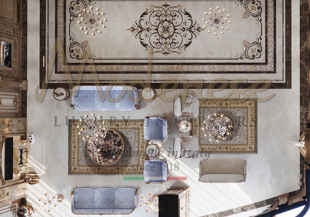 Living room seen from above with light blue fabric upholstered sofas and armchairs chandeliers floor marble decoration and detailed rug Modenese