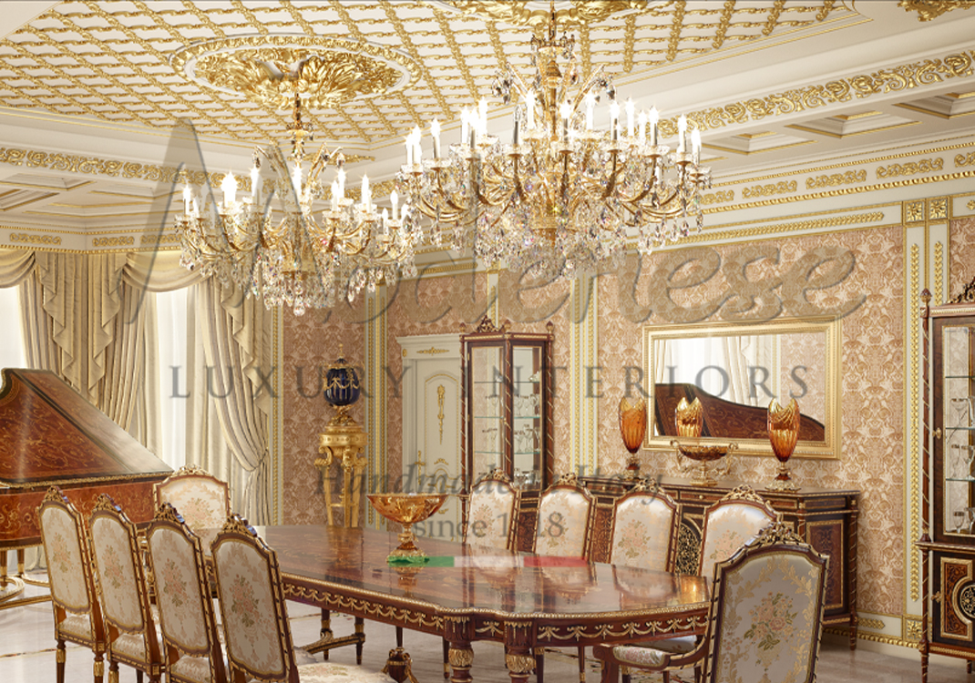 Classic style metallic gold chandeliers in Modenese dining room with inlaid wooden top table and gold leaf details