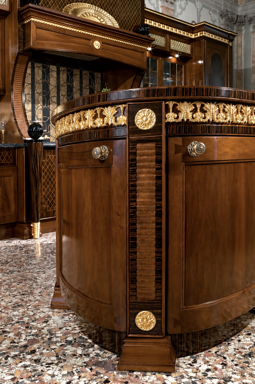Curved kitchen island with gilded decorative band and rosettes in the Majestic kitchen, Jeddah