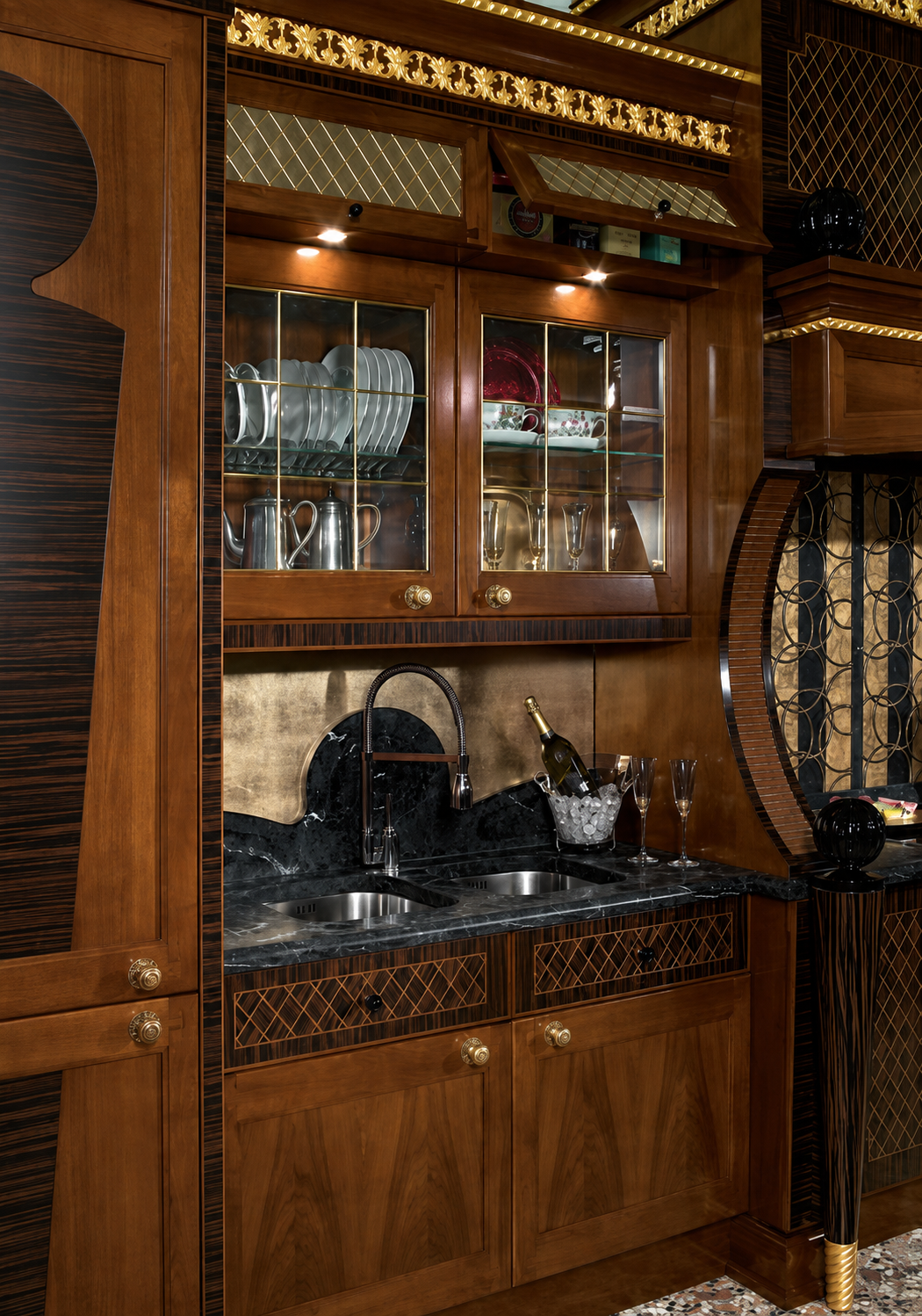 Black marble worktop, glass-fronted display cabinets and integrated lighting in a luxury Jeddah kitchen