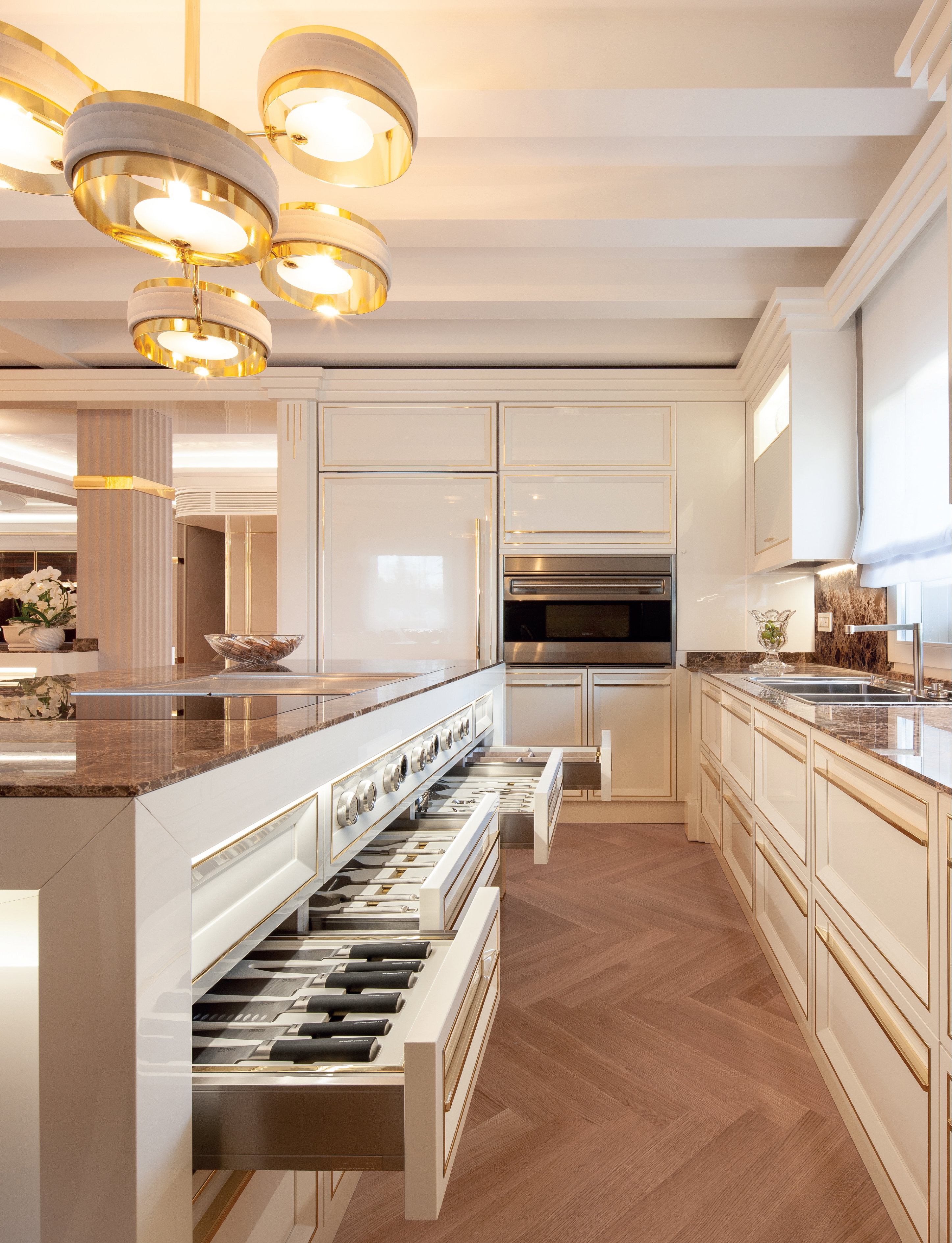 Dark marble worktops and island with integrated drawers in the Prestige kitchen, Abu Dhabi