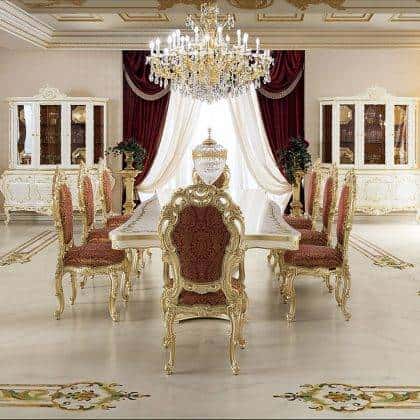 This luxurious dining room features golden details and elegant chandelier, making it a true statement of luxury and class.