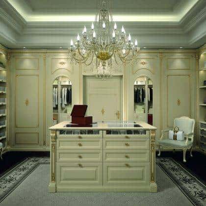 elegant italian artisanal dressing room production high-end made in Italy handcrafted furniture center island elegant golden leaf details finishes majestic cabinet wardrobe ideas premium quality solid wood interiors ornamental interiors elegant home decorations royal palace traditional timeless made in italy design production